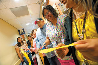 Tsalie Health Center employees cut the ribbon for a new breastfeeding room for nursing mothers on Thursday. © 2011 Gallup Independent / Adron Gardner 